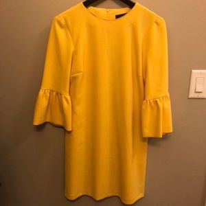 Canary yellow bell sleeved dress.